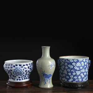 <b>A CELADON GLAZED PORCELAIN VASE, A CACHEPOT AND A JARDINIÈNE WITH UNDERGLAZE BLUE FLORAL DECORATION</b>