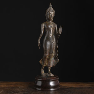 <b>A SUKHOTHAI STYLE STRIDING BRONZE FIGURE OF BUDDHA</b>