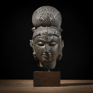 <b>A STONE HEAD OF A FEMALE DIVINITY</b>
