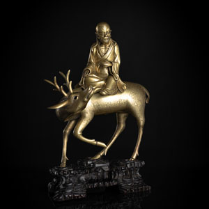 <b>Weihrauchbrenner des Laotse auf einem Hirsch in messingfarbener Bronze auf Holzsockel</b>