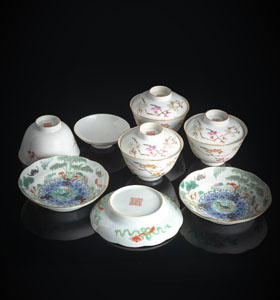 <b>FOUR 'FAMILLE ROSE' TEA BOWLS AND COVERS WITH PRUNUS DECORATION AND THREE SAUCERS DEPICTING LIUHAI PLAYING WITH THE THREE-LEGGED TOAD</b>