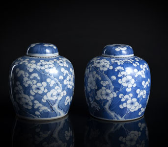 <b>A PAIR OF BLUE AND WHITE 'CRACKED ICE'  PRUNUS JARS AND COVERS</b>