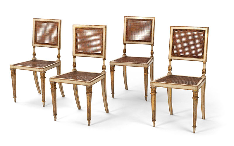 <b>A SET OF FOUR ITALIAN WHITE PAINTED AND PARCEL GILT SIDE CHAIRS</b>