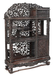 <b>AN INTRICATELY CARVED OPENWORK DRAGON, QILIN, BAMBOO AND POMEGRANATE DISPLAY CABINET</b>