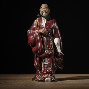 <b>A POLYCHROME 'SHIWAN' CERAMIC FIGURE OF LÜ DONGBIN</b> <b>A POLYCHROME 'SHIWAN' CERAMIC FIGURE OF LÜ DONGBIN</b>