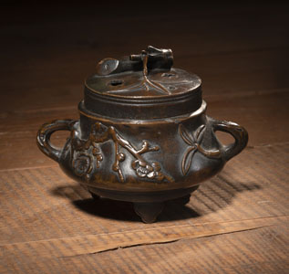 <b>A SMALL PRUNUS AND BAMBOO RELIEF BRONZE KORO</b>