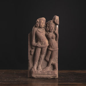 <b>A SANDSTONE SCULPTURE OF SHIVA WITH PARVATI</b>