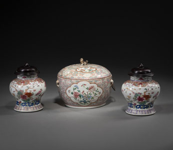 <b>A 'FAMILLE ROSE' PORCELAIN BOX AND COVER AND TWO VASES WITH WOOD COVERS</b>