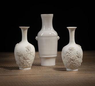<b>A PAIR OF BISCUIT PORCELAIN RELIEF CHRYSANTHEMUM VASES AND A DEHUA-WARE VASE</b>