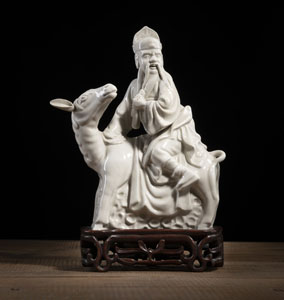<b>A 'DEHUA' PORCELAIN FIGURE OF CAO GUOJU ON A MULE</b> <b>A 'DEHUA' PORCELAIN FIGURE OF CAO GUOJU ON A MULE</b>