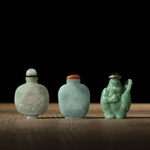 <b>TWO JADE SNUFF BOTTLES, PARTLY CARVED WITH DRAGONS, AND ANOTHER SNUFF BOTTLE IN THE SHAPE OF THE SHOULAO</b> <b>TWO JADE SNUFF BOTTLES, PARTLY CARVED WITH DRAGONS, AND ANOTHER SNUFF BOTTLE IN THE SHAPE OF THE SHOULAO</b>