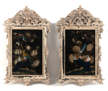 <b>A PAIR OF POLYCHROME REVERSE GLASS PAINTINGS OF BIRDS AND FLOWERS IN CARVED OPENWORK FRAMES</b>