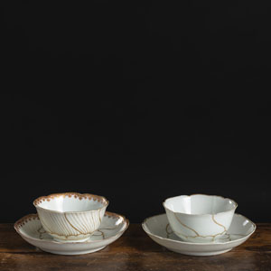 <b>TWO GOLD-PAINTED PORCELAIN CUPS AND SAUCERS</b>