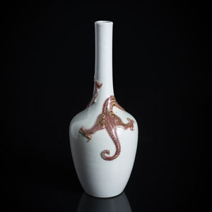 <b>A PORCELAIN BOTTLE VASE WITHJ A MOLDED AND PEACHBLOOM-DECORATED DRAGON</b>