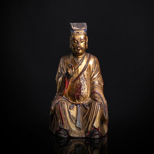 <b>A GILT- AND RED-LACQUERED WOOD FIGURE OF A DIGNITARY</b>