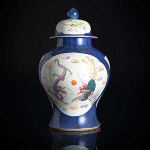 <b>A POWDERBLUE-GROUND AND FAMILLE VERTE DECORATED PORCELAIN VASE AND COVER</b>