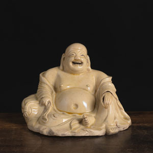 <b>A GOOD BEIGE-YELLOW GLAZED FIGURE OF SEATED BUDAI</b>