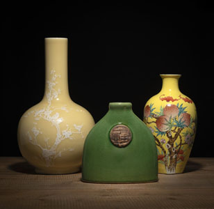 <b>A YELLOW-GROUND WHITE BRANCHES PORCELAIN BOTTLE VASE, A YELLOW PEACHES SHOULDER VASE, AND GREEN VASE OF OVAL SHAPE WITH MEDALLION</b>