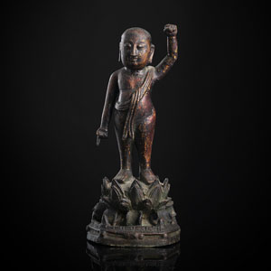 <b>A GILT-LACQUERED BRONZE FIGURE OF STANDING INFANT BUDDHA ON A LOTUS</b>