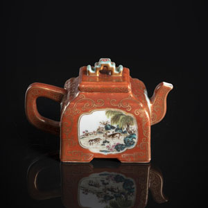 <b>A FAMILLE ROSE DECORATED CORAL-GROUND GILT-DECORATED TEAPOT AND COVER</b>
