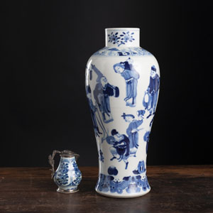<b>A BLUE AND WHITE FIGURAL PORCELAIN VASE AND A SMALL SILVER-MOUNTED CREAMER</b>