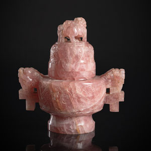 <b>A WELL CARVED ROSE QUARTZ CENSER AND COVER ON WOOD STAND</b>