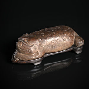<b>A BROWNISH STONE CARVING OF A THREE-LEGGED TOAD WITH WOOD STAND</b>