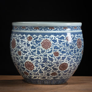 <b>A LARGE UNDERGLAZE-BLUE AND COPPER-RED LOTUS PORCELAIN JARDINÈRE</b>
