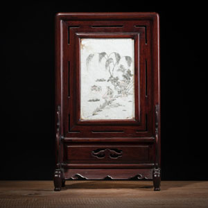 <b>A WOOD TABLE SCREEN WITH AN INLAID PANEL PAINTED IN GRISAILLE AND IRON RED WITH FISHERMEN AT THE SHORE</b>