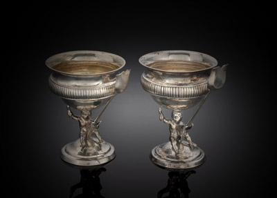 <b>A PAIR OF GERMAN SILVER SALT CELLARS AND SPOONS WITH PUTTI</b>