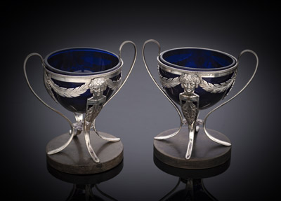 <b>A PAIR OF RHENISH OPENWORK SILVER SALT CELLARS WITH BLUE GLASS LINERS</b>