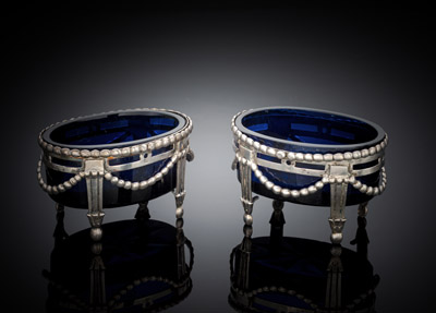 <b>A PAIR OF GERMAN OPENWORK SILVER SALT CELLARS WITH BLUE GLASS LINERS</b>