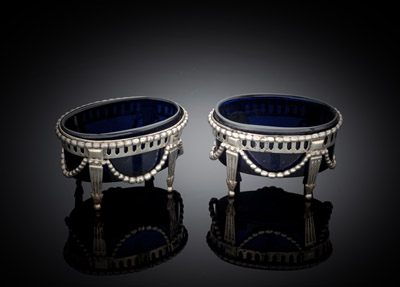 <b>A PAIR OF GERMAN OPENWORK SILVER SALT CELLARS WITH BLUE GLASS LINERS</b>