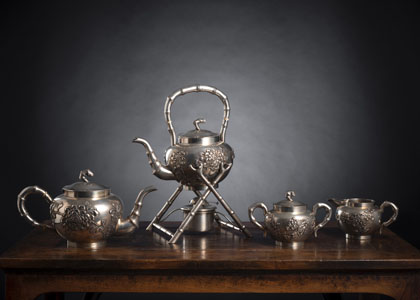<b>A SILVER SERVICE WITH TEA AND COFFEE POT WITH RECHAUD, MILK JUG AND SUGAR BOX AND COVER WITH CHRYSANTHEMUM DECORATION</b>