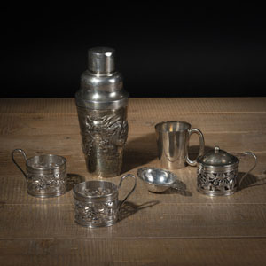 <b>A GROUP OF SILVER OBJECTS, INCLUDING A DRAGON SHAKER, SUP COASTER IN OPENWORK</b>