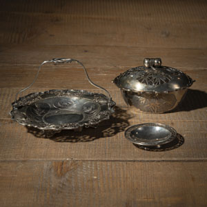 <b>A SILVER COVERED BOWL, A BOWL WITH HANDLE AND A SMALL BOWL WITH FLORAL DECORATION, PARTLY IN OPENWORK</b>