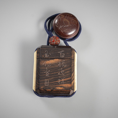 <b>AN INSCRIBED POLYGONAL IVORY-INLAID WOOD INRO WITH FRUIT KERNEL OJIME AND WOOD NETSUKE</b>