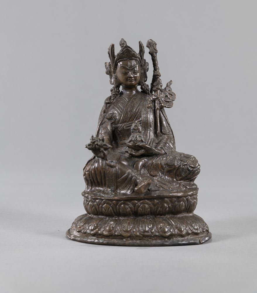 <b>A COPPER FIGURE OF SEATED PADMASAMBHAVA</b>