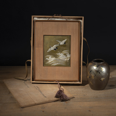 <b>A MIXED-METALL PANEL WITH ENGRAVED DECORATION OF A PAIR OF CRANES AND A VASE WITH SPARROWS PERCHED ON SPRAYS</b>