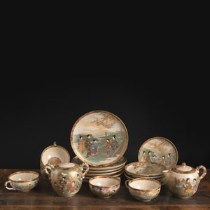 <b>A 20-PIECE FLORAL AND FIGURAL 'SATSUMA' PORCELAIN SERVICE</b>