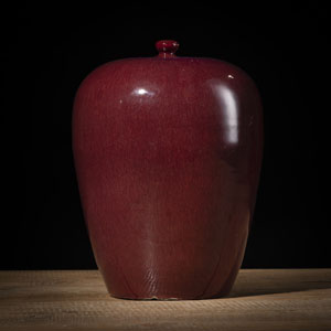 <b>A COPPER-RED VASE AND COVER</b>
