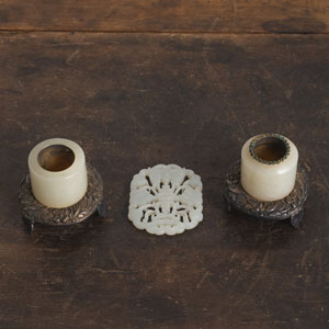 <b>TWO SILVER-MOUNTED JADE ARCHER RINGS AND A 'SHOU' PENDANT</b>