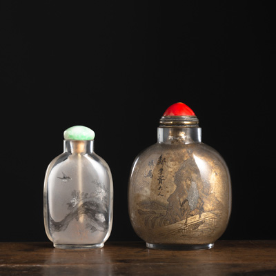 <b>TWO GLASS SNUFF BOTTLES WITH INSIDE PAINTING: A BRANCH WITH PEONIES AND A BIRD IN GRISAILLE, AND FIGURAL SCENES</b>