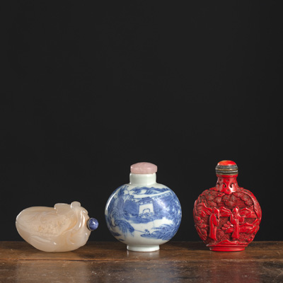 <b>THREE RED-LACQUER, PORCELAIN, AND JADE SNUFFBOTTLES</b> <b>THREE RED-LACQUER, PORCELAIN, AND JADE SNUFFBOTTLES</b>