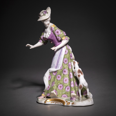 <b>A NYMPHENBURG PORCELAIN FIGURE OF A LADY ATTACKED BY A DOG</b>