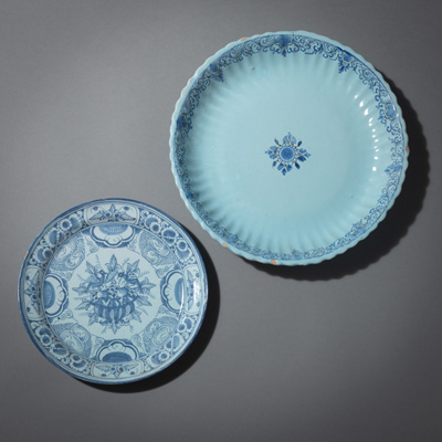 <b>TWO BLUE PAINTED FAYENCE ROUND DISHES</b>