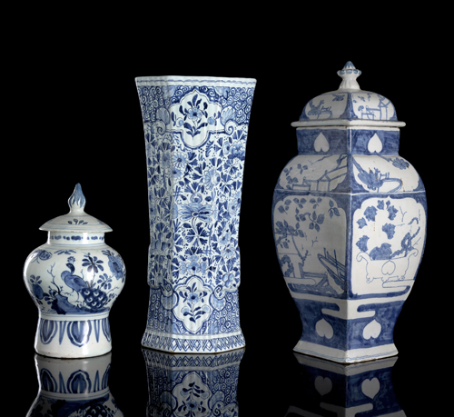 <b>TWO BLUE AND WHITE FAYENCE VASES AND LIDS AND A CYLINDRIC FAYENCE VASE</b>