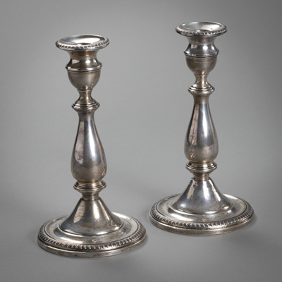 <b>A PAIR OF STERLING SILVER CANDLESTICKS</b>