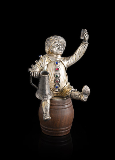 <b>A GERMAN SILVER AND MOTHER OF PEARL MINIATURE FIGURE OF A WINEDRINKER</b>