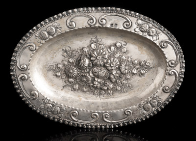 <b>A SILVER OVAL DISH WITH FLORAL DECOR</b>